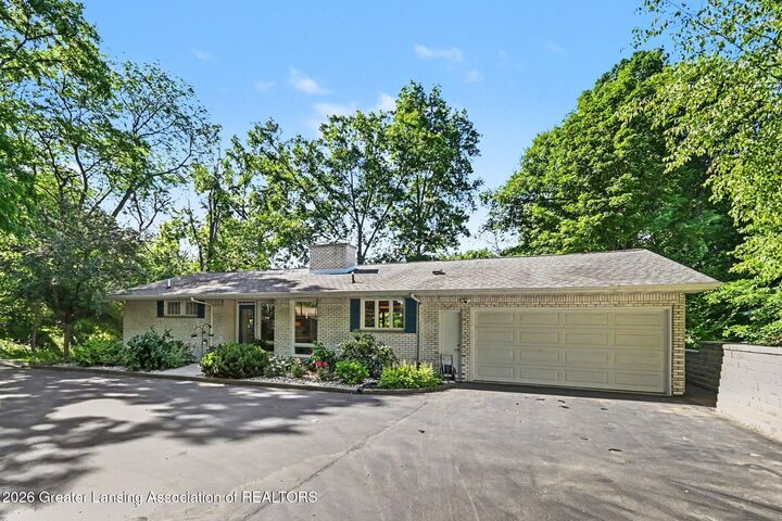 Property Photo:  4811 Delta River Drive  MI 48906 