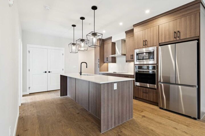 Property Photo:  1802 Mahogany Boulevard SE 7121  AB T3M 4A5 