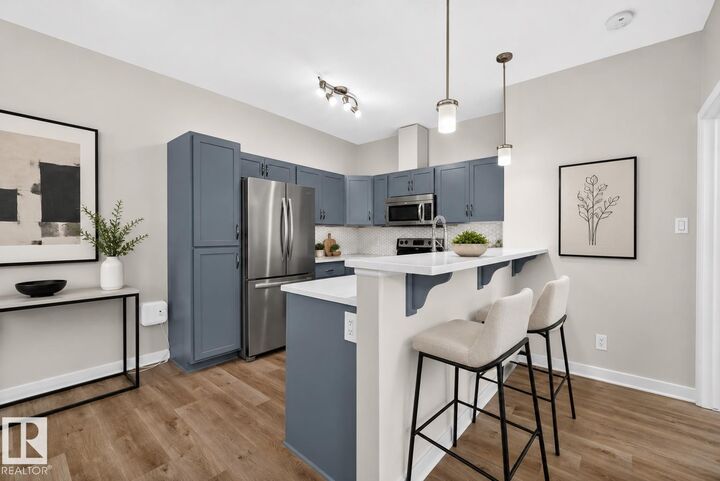 Property Photo: 304 Ambleside Link SW 103 AB T6W 0V2