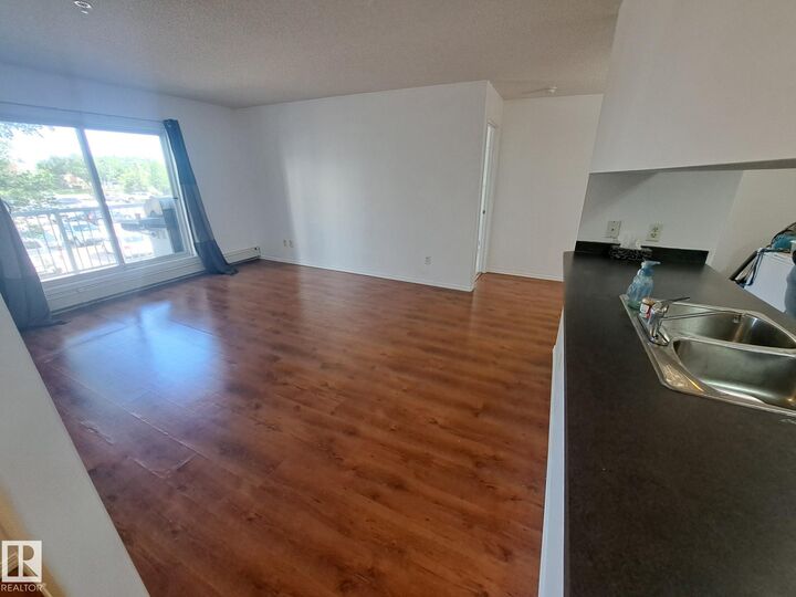 Property Photo: #205 9910 107 Street AB T8R 0A3