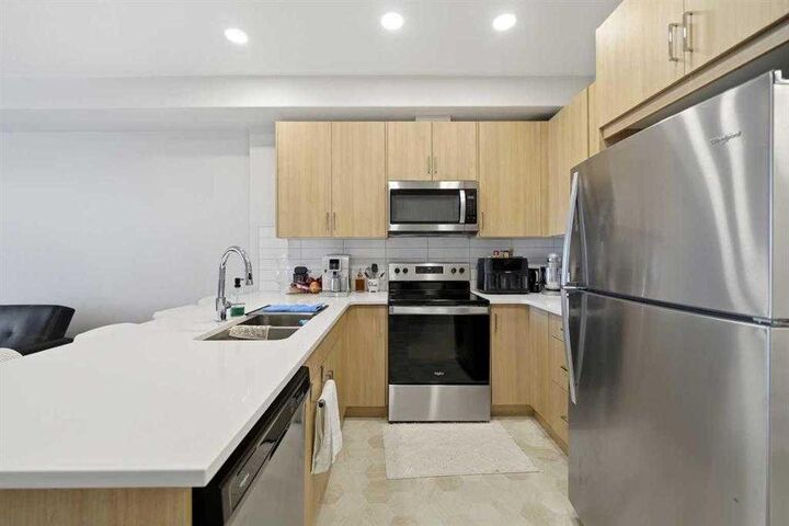 Property Photo:  55 Wolf Hollow Crescent SE 318  AB T2X 5K9 