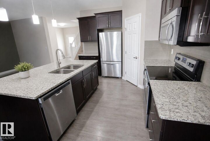 Property Photo:  8 Meadowlink Cm  AB T7X 0W1 