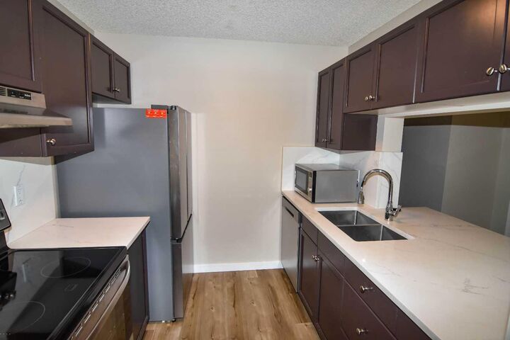 Property Photo:  2022 Canyon Meadows Drive SE 109  AB T2J 7H1 