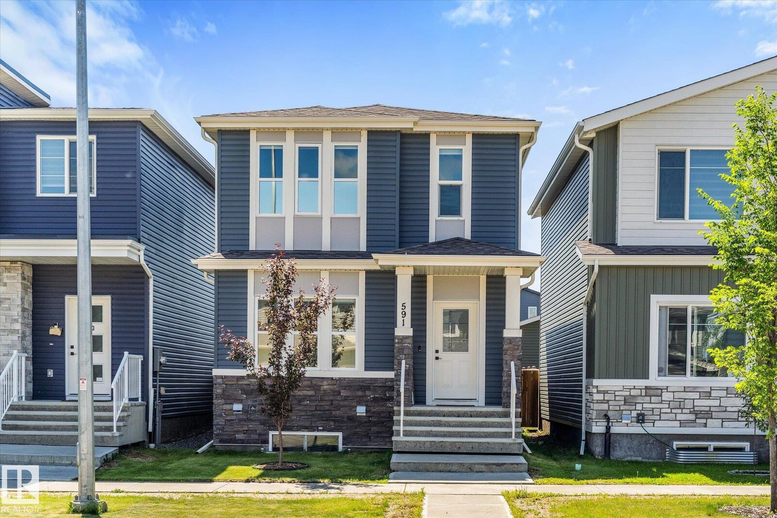 Property Photo:  591 Meadowview Drive  AB T8L 0X1 