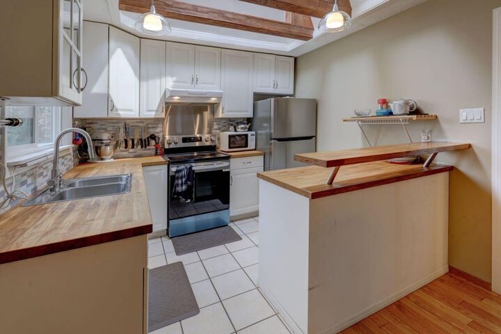 Property Photo: 128 Pineland Place NE AB T1Y 3K2
