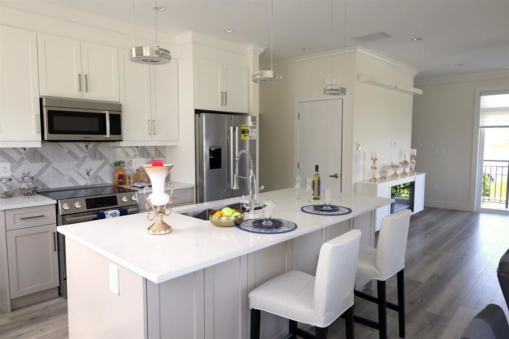 Property Photo: 8181 135A Street 30 BC V3W 3N8