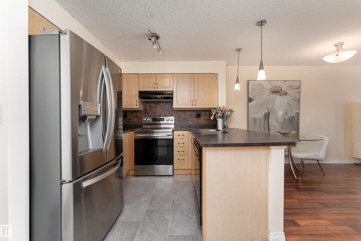 Property Photo: 11441 Ellerslie Road SW 317 AB T6W 1S9