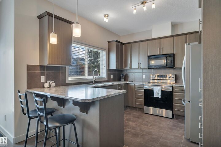 Property Photo:  450 McConachie Way NW 36  AB T5Y 0S8 