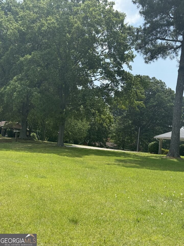 Property Photo:  7359 Pleasant Hill Road  GA 30058 
