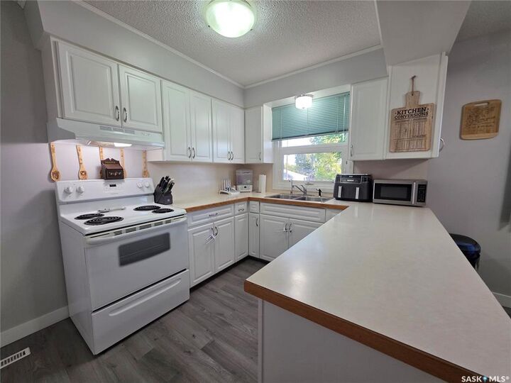 Property Photo:  303 13th Avenue NE  SK S9H 2V9 