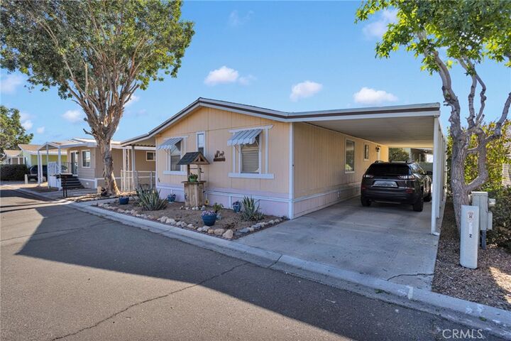Property Photo:  9161 Santa Fe E 72  CA 92345 