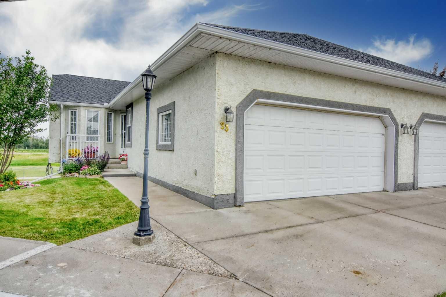 Property Photo: 33 Strathmore Lakes Bay AB T1P 1L8