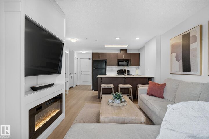 Property Photo: 5521 7 Avenue SW 203 AB T6X 2A8