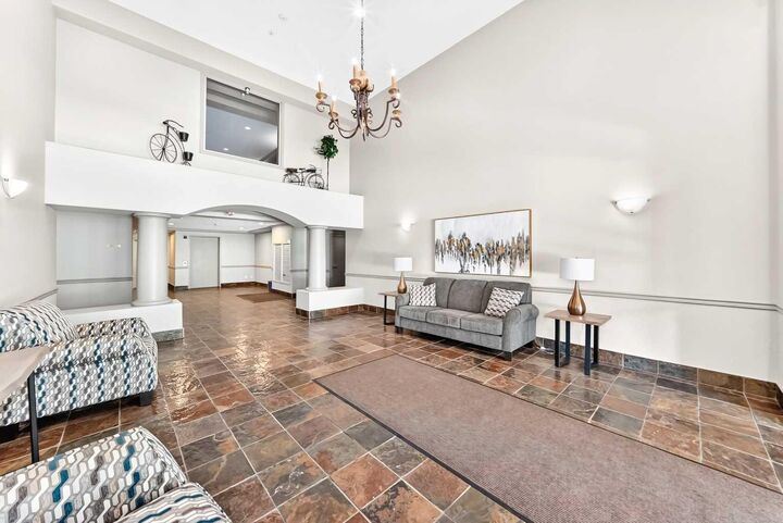 Property Photo: 303 Arbour Crest Drive NW 2215 AB T3G 5G4
