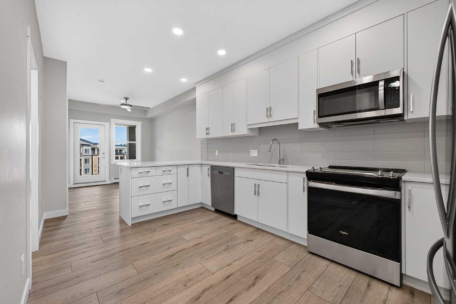 Property Photo:  55 Wolf Hollow Crescent SE 411  AB T2X 5K9 