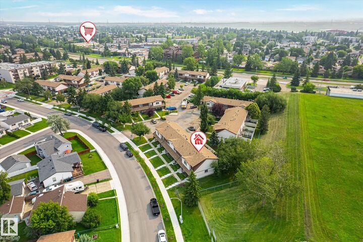 Property Photo:  13833 30 Street NW 2  AB T5Y 2B2 