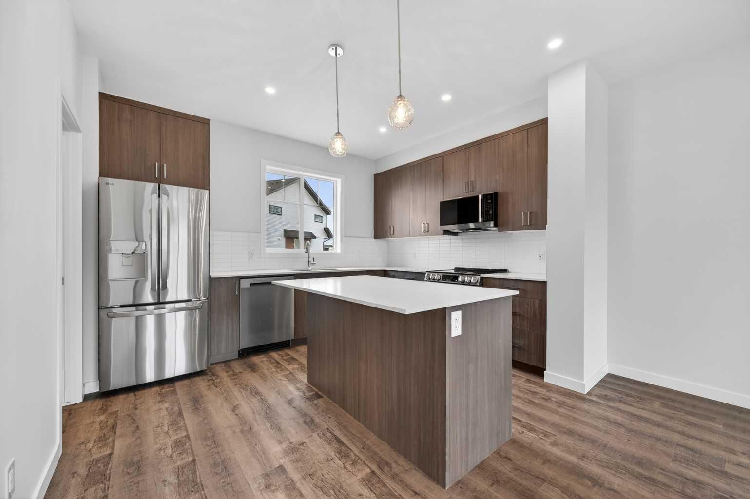 Property Photo: 28 Red Embers Plaza NE 205 AB T3N 2W1