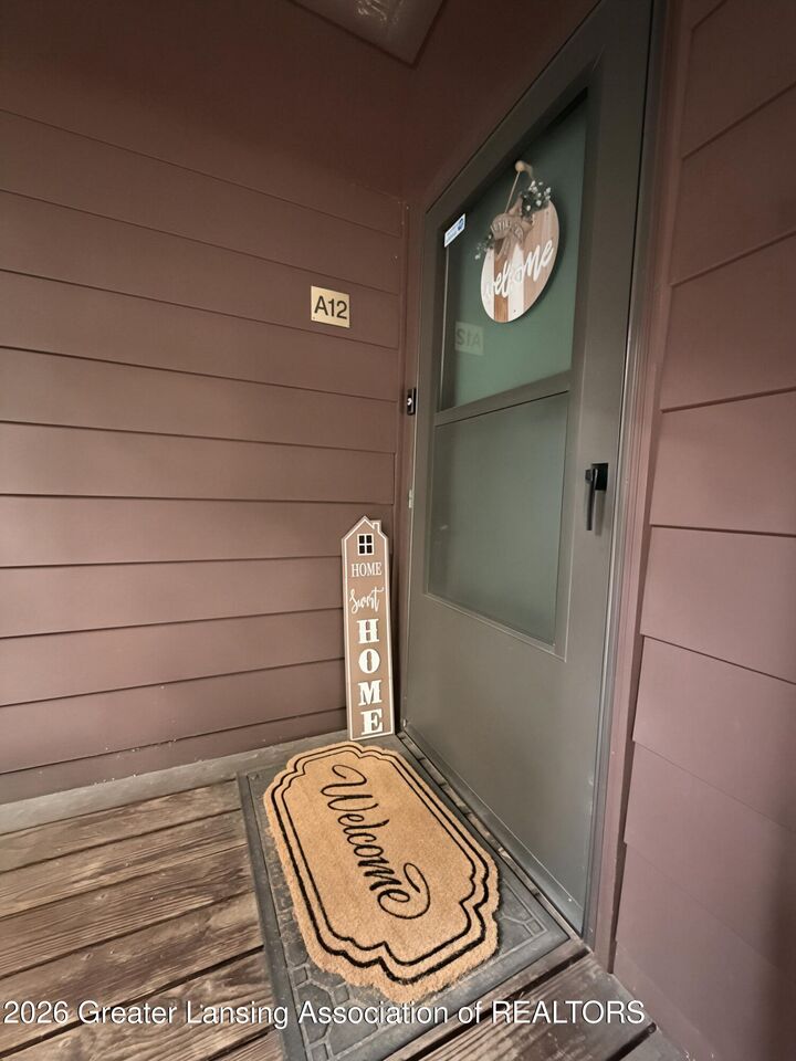 Property Photo:  205 E Jolly Road  MI 48910 