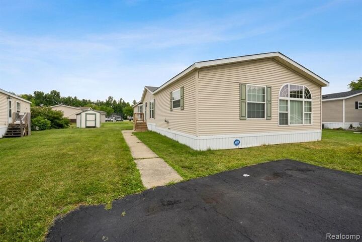 Property Photo:  9327 Greentree Drive  MI 48166 9561 