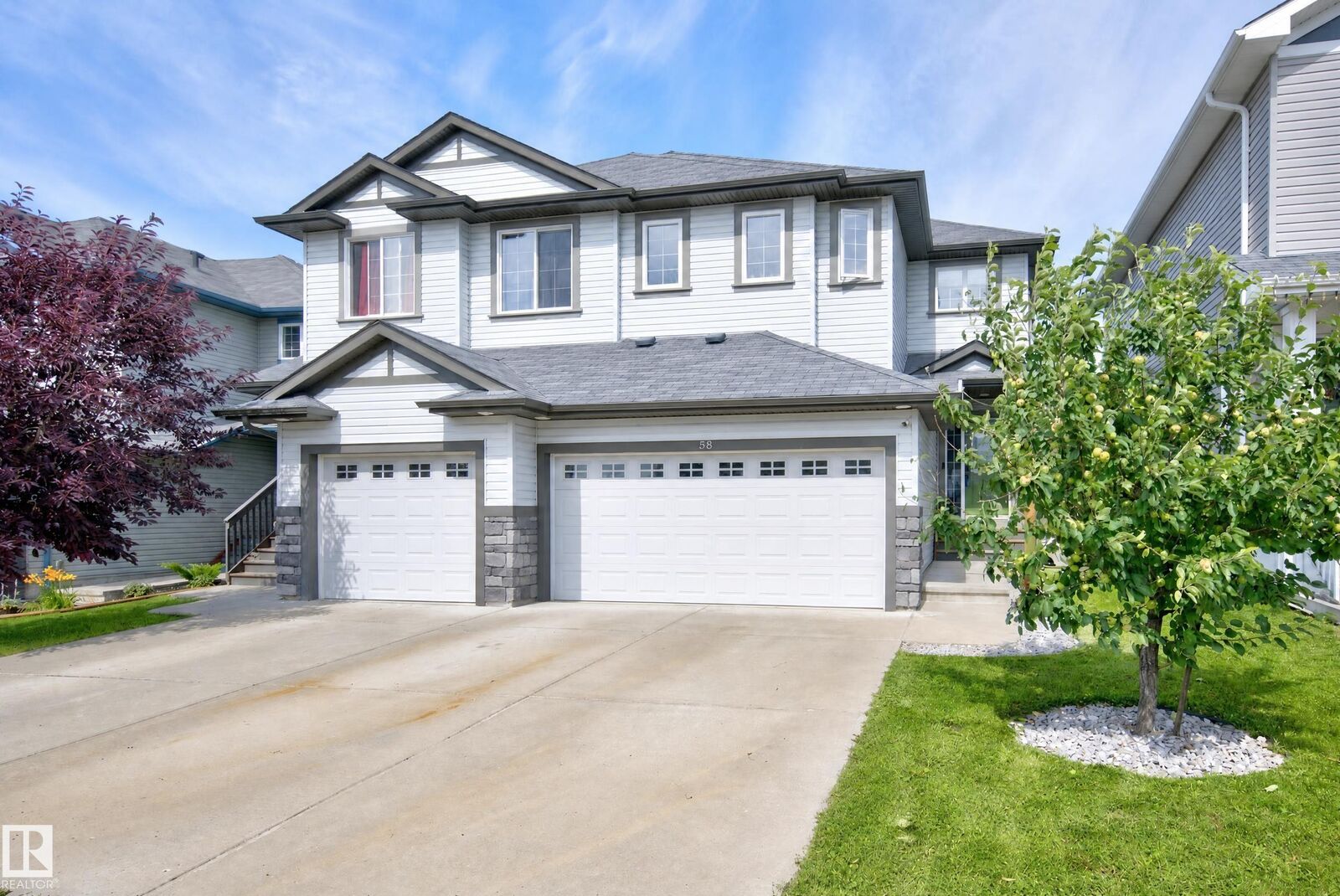 Property Photo: 58 Woodbridge Link AB T8L 0H8