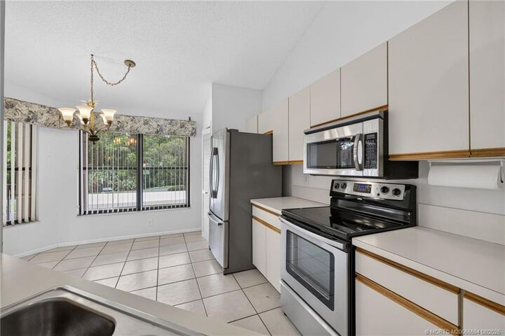 Property Photo:  3410 SE Martinique Trace 201  FL 34997 