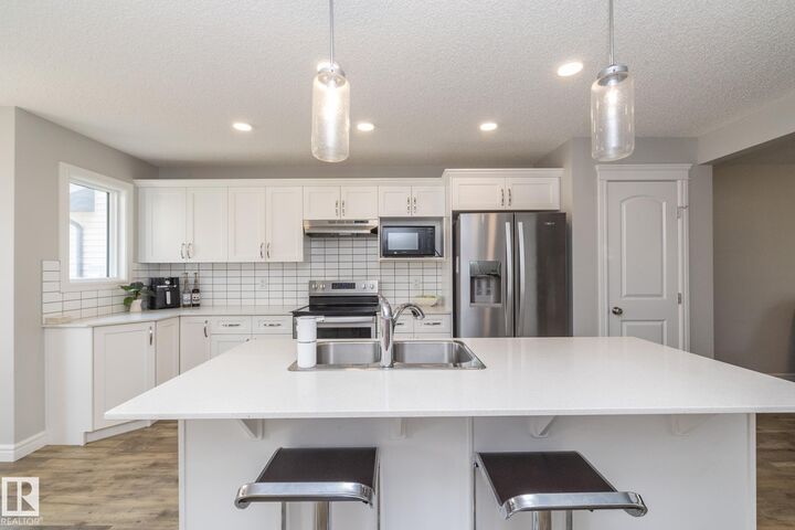 Property Photo: 803 Secord Boulevard NW AB T5T 7K2