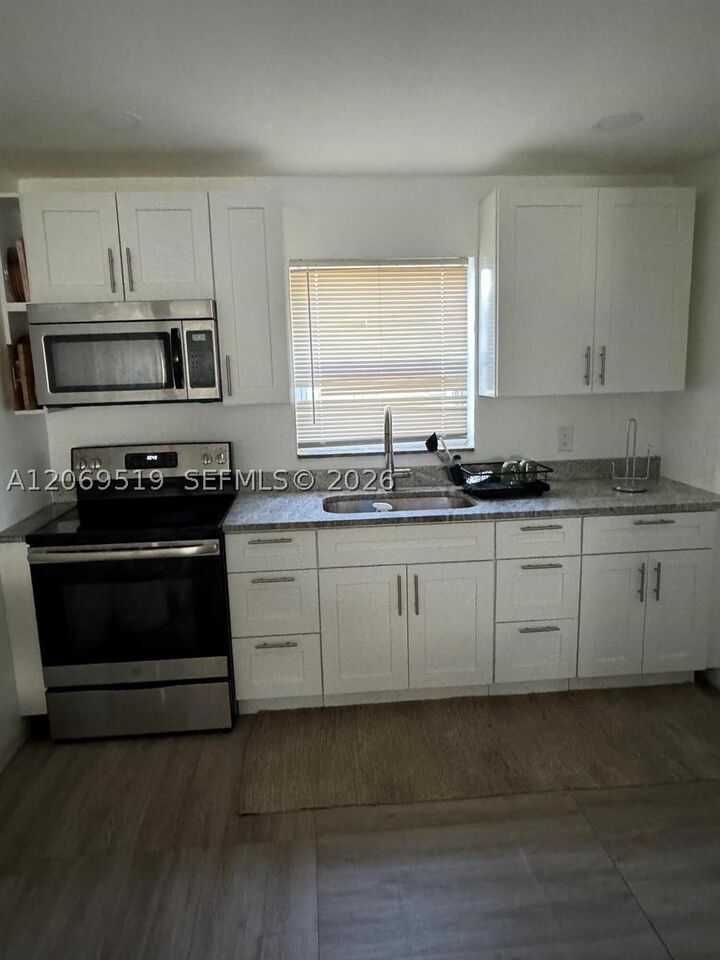 Property Photo:  1281 W 35th St  FL 33404 