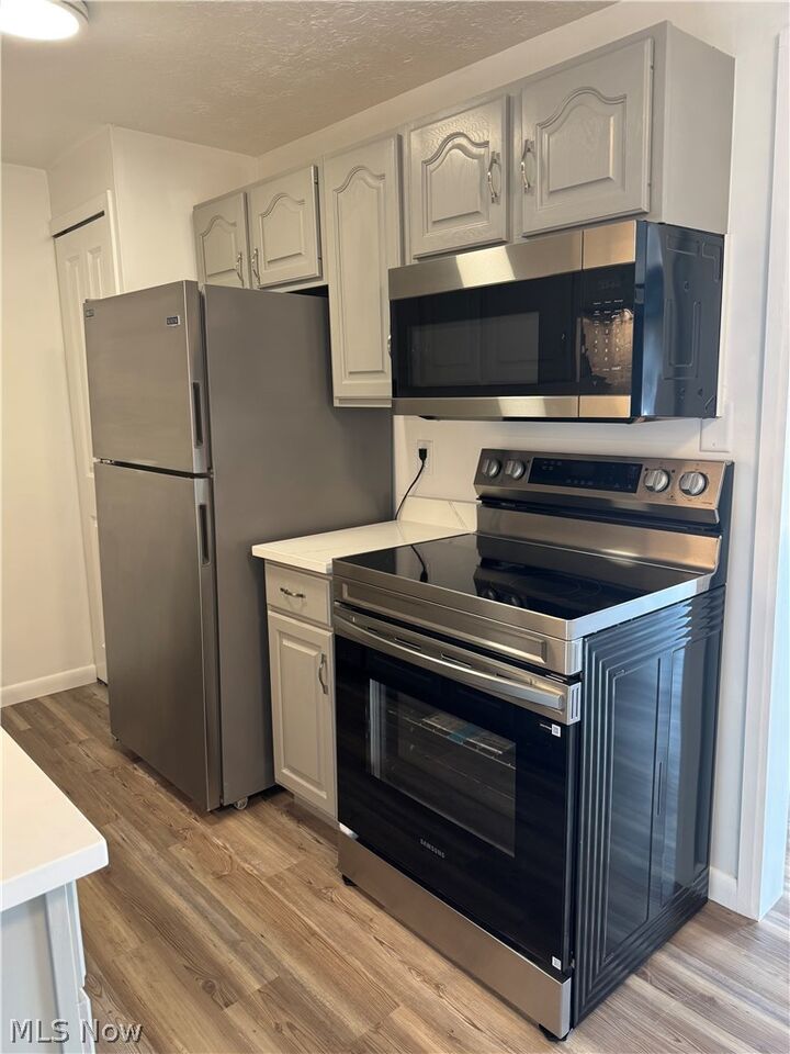 Property Photo: 9911 Sunrise Boulevard Q10 OH 44133