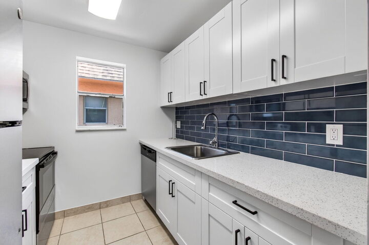 Property Photo:  450 SW 2nd Avenue 205  FL 33432 