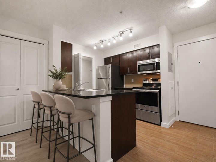 Property Photo: 5816 Mullen Place NW 205 AB T6R 0W3