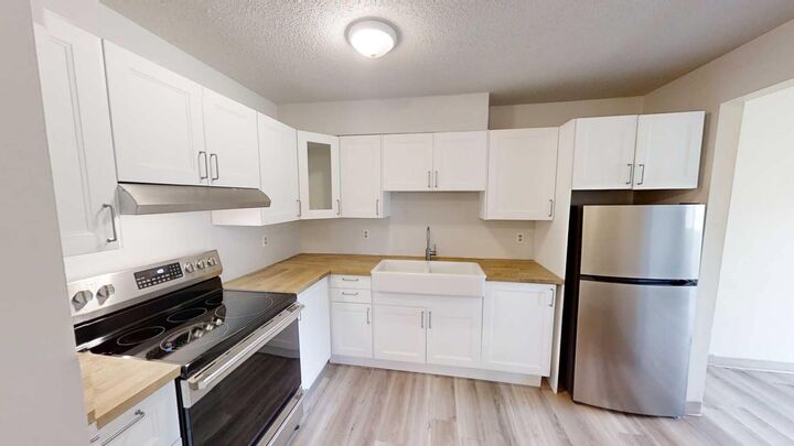 Property Photo:  5117 44 Street 114  AB T0G 1E0 