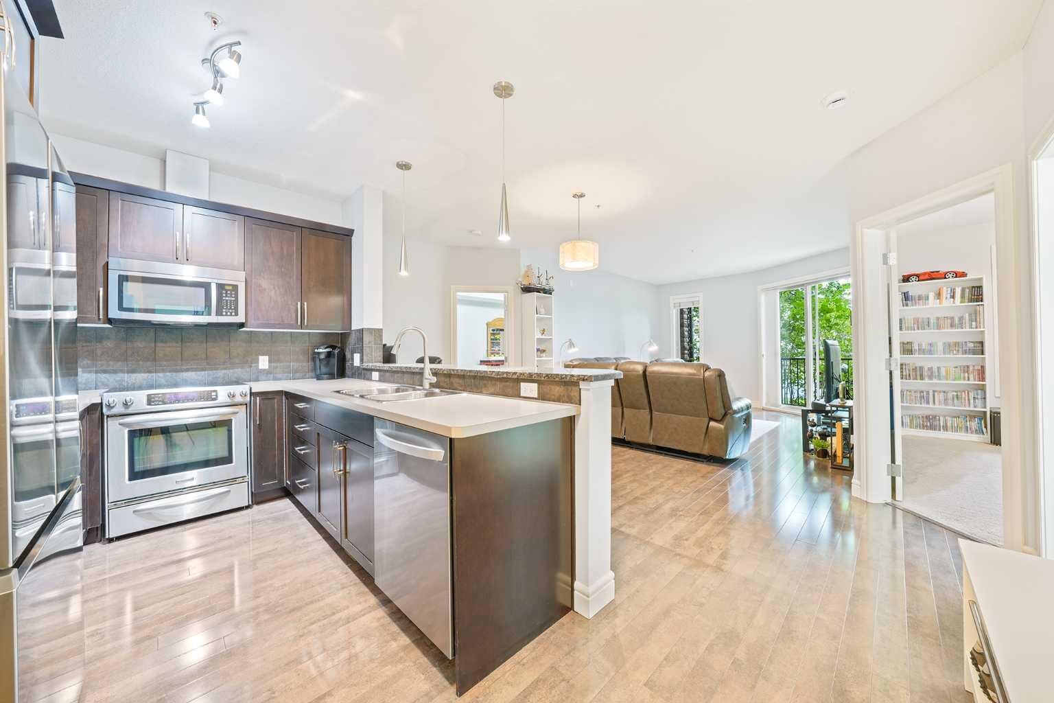 Property Photo:  15 Sunset Square 3104  AB T4C 0E7 