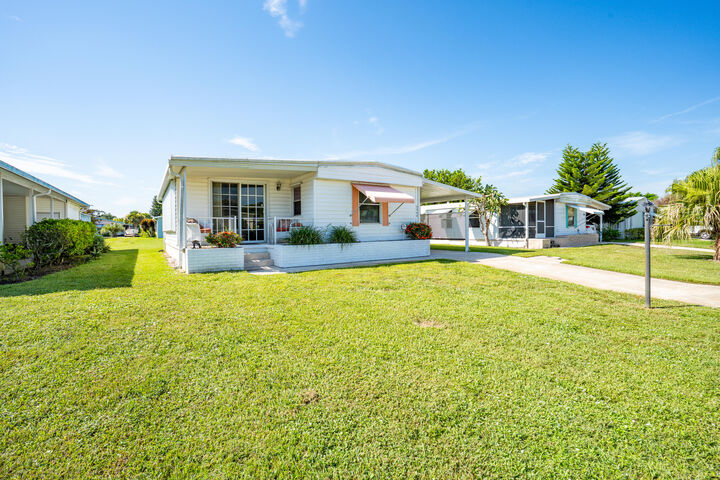 Property Photo:  6948 SE Delegate Street  FL 33455 