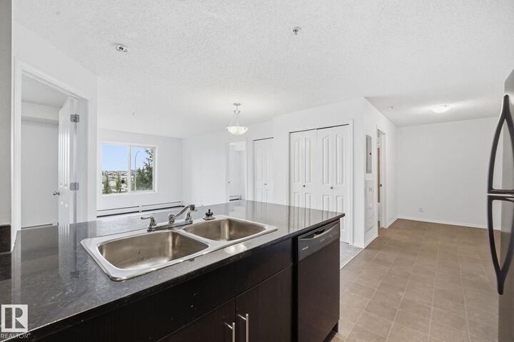 Property Photo:  11804 22 Avenue SW 314  AB T6W 2A2 