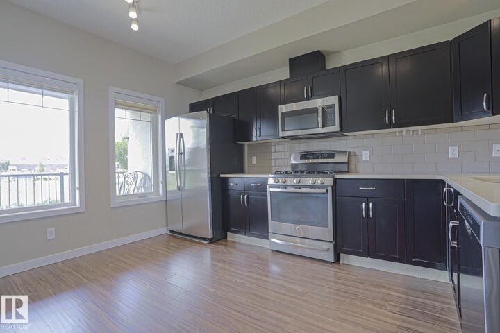 Property Photo:  5873 Mullen Place NW 13  AB T6R 0T5 