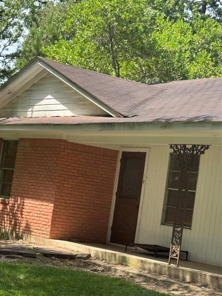 Property Photo:  310 S Highway 150  TX 77331 
