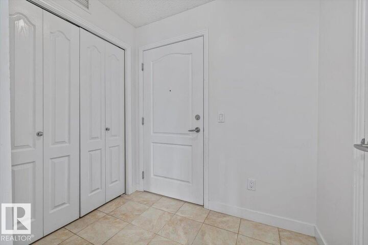 Property Photo:  12660 142 Avenue NW 114  AB T5X 0J5 