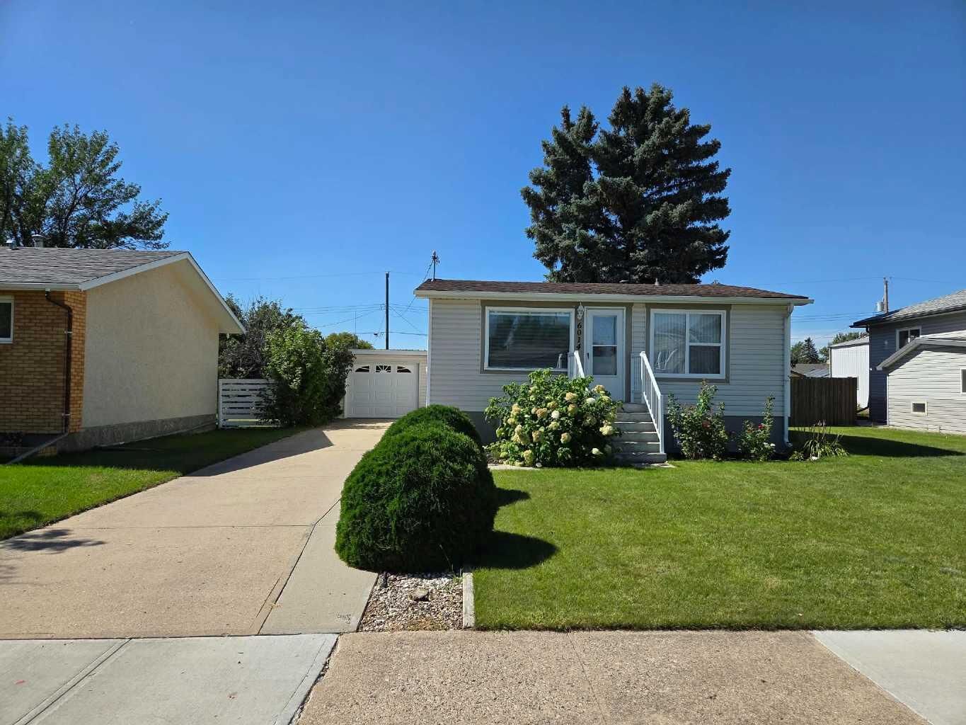Property Photo:  6014 52 Street  AB T1G 1K4 