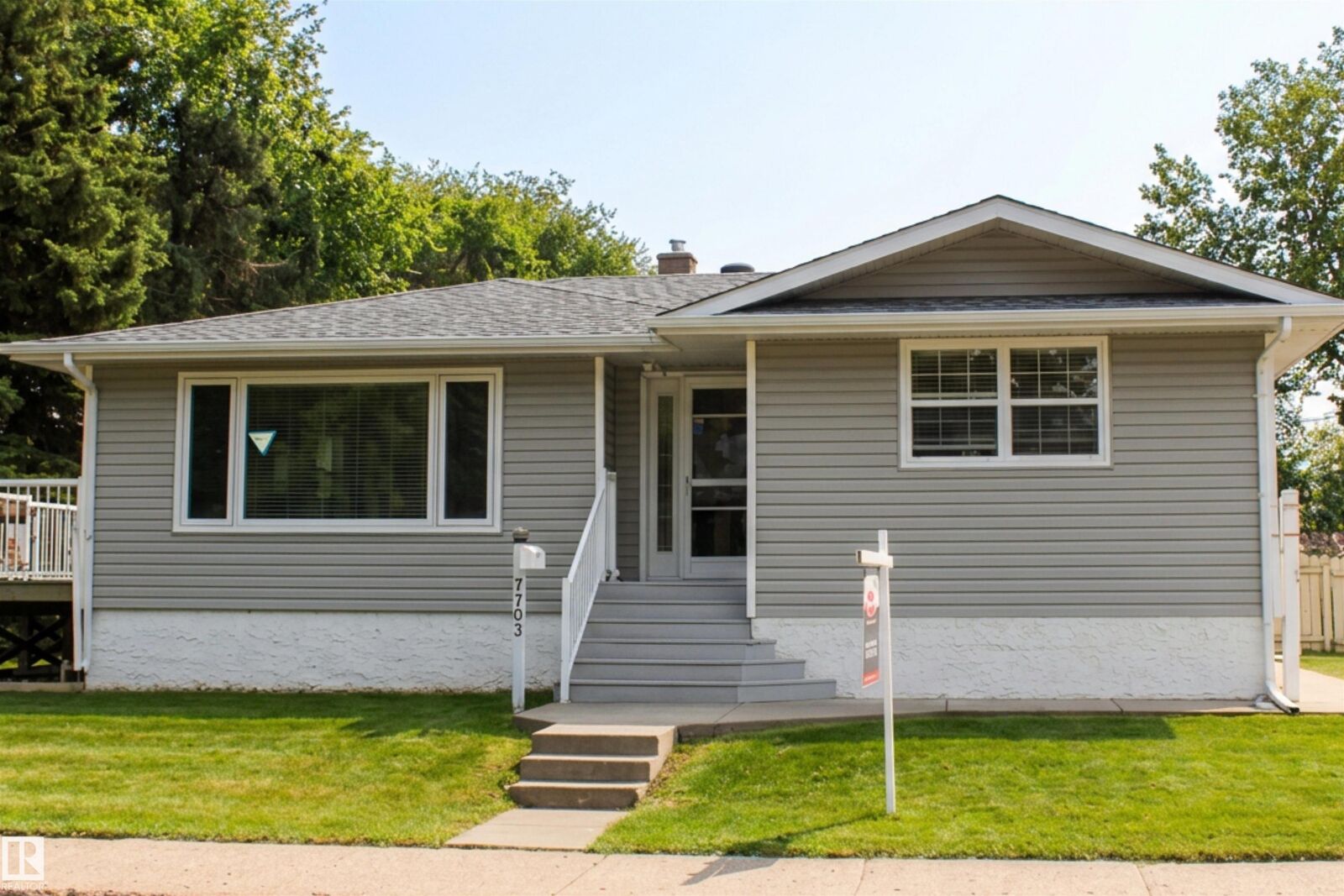 Property Photo:  7703 104 Avenue NW  AB T6A 0J4 