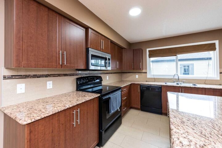 Property Photo:  212 Panatella Drive NW  AB T3K 0T4 