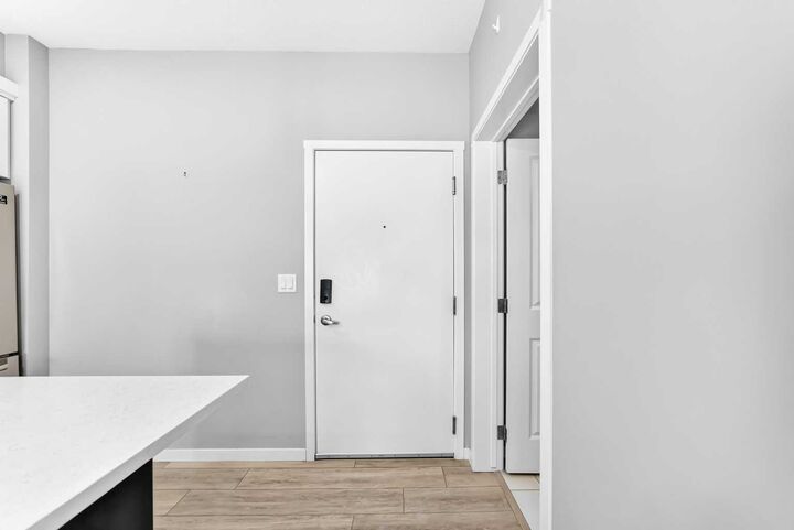 Property Photo:  360 Harvest Hills Common NE 306  AB T3K 2N1 