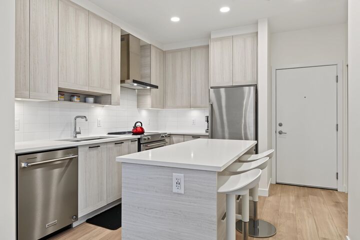 Property Photo:  7169 14th Avenue 218  BC V3N 0H6 