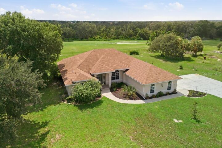 Property Photo: 8011 SW Sunny Oaks Drive FL 34269