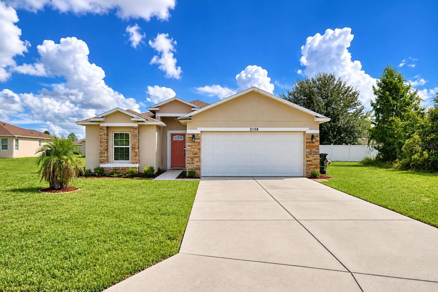 Property Photo: 2128 Orchid Way FL 34759