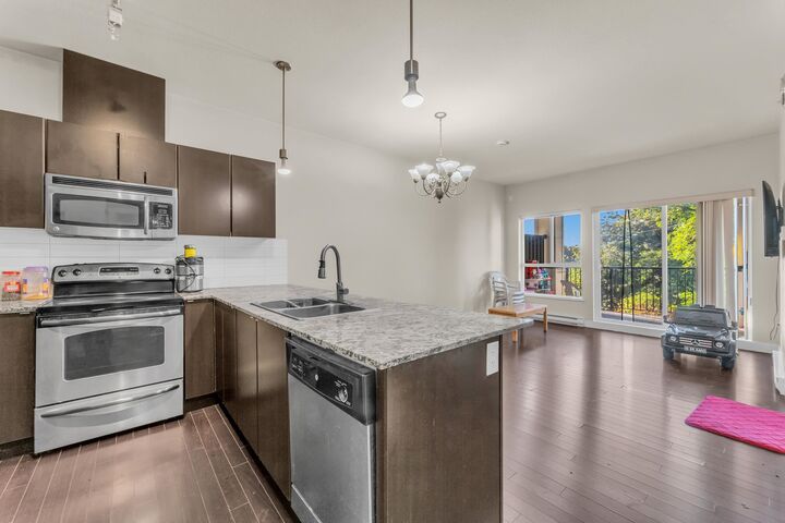 Property Photo: 9655 King George Boulevard 409 BC V3T 0C7