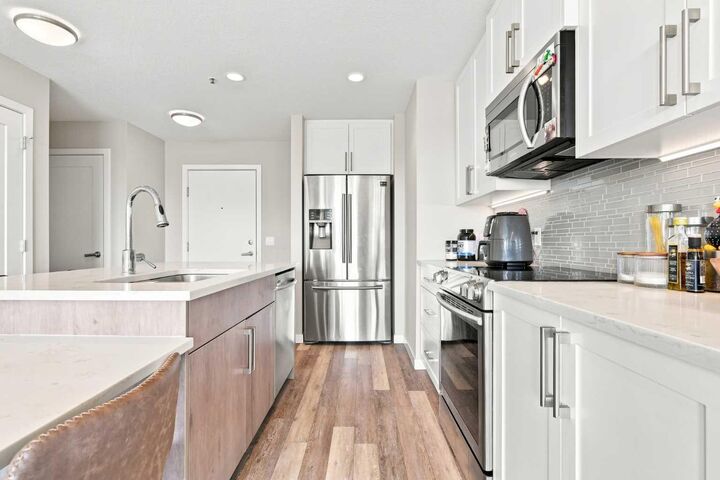 Property Photo:  8530 8A Avenue SW 320  AB T3H 6A7 