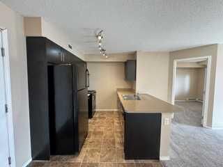 Property Photo:  7130 80 Avenue NE 404  AB T3J 0N5 