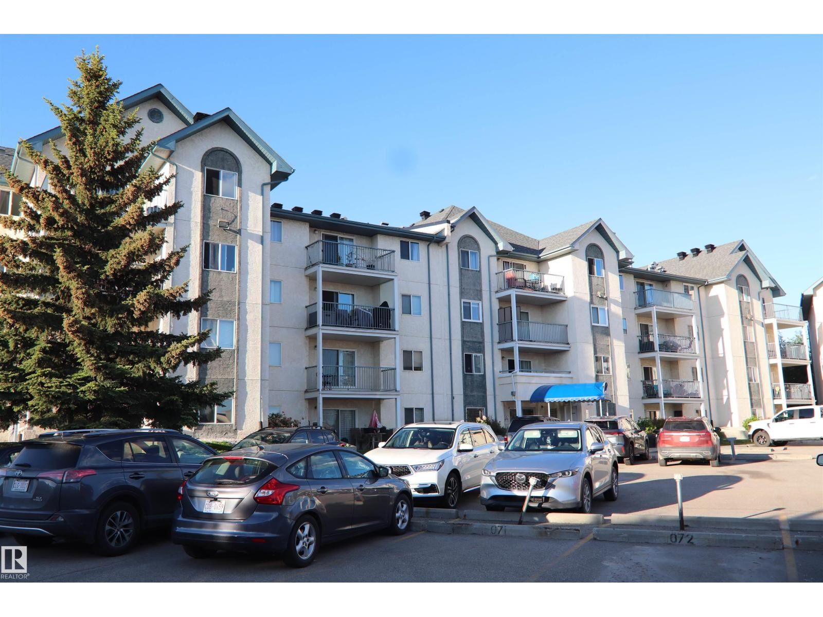 Property Photo:  #421 6720 158 Av NW  AB T5Z 3B1 