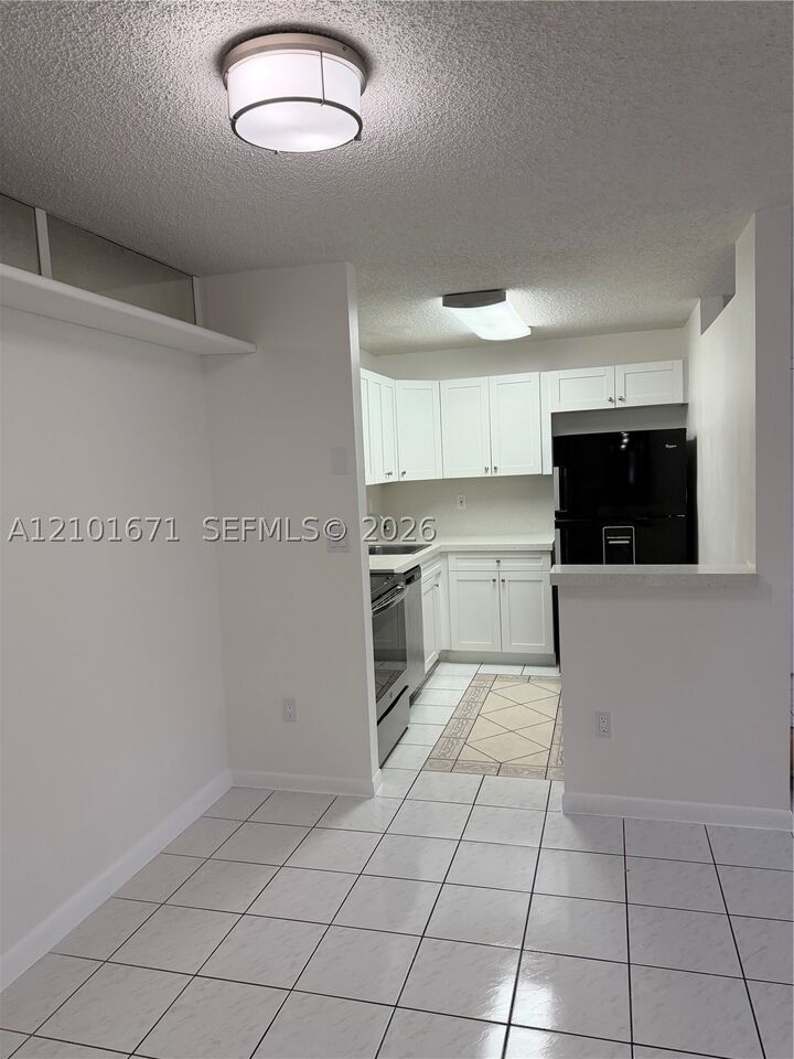 Property Photo:  4690 NW 102nd Ave 103-24  FL 33178 