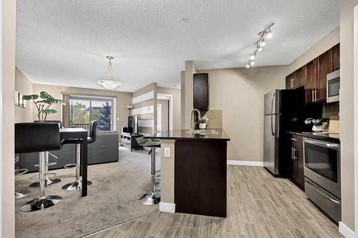 Property Photo:  15 Saddlestone Way NE 209  AB T3J 0S3 
